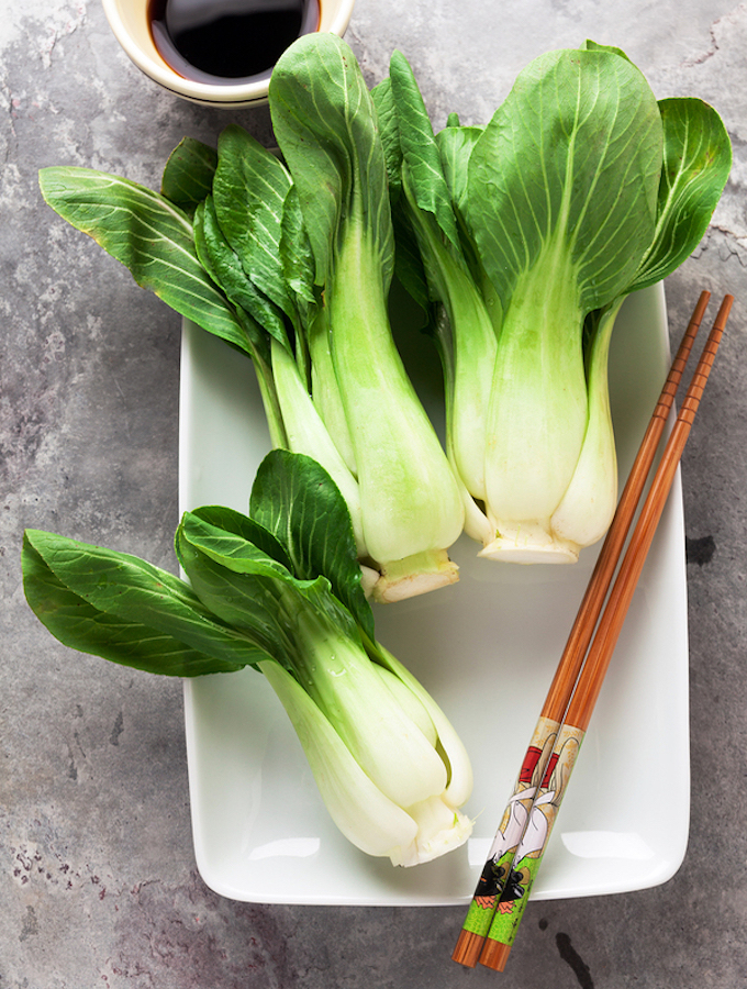 Fresh Not Cooked Bok Choy And Soy Sauce On Grey Table. Chinese Chopsticks. Asian Cuisines Ingredient